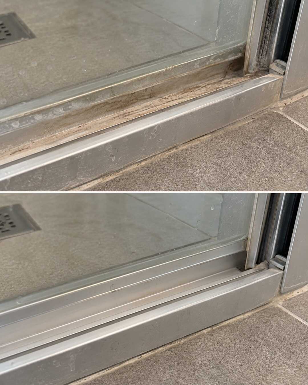 Close-up of the same anodized aluminum lower shower-door track, moderate beige soap residue before on top and realistically clean after below; no restored scratches, same angle.