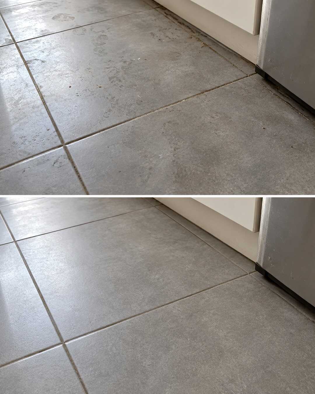 Same matte grey porcelain kitchen floor tiles in oblique natural window light, modest detergent haze before top and clean dry after bottom, exact same grout and subtle texture, no polished finish or color change.